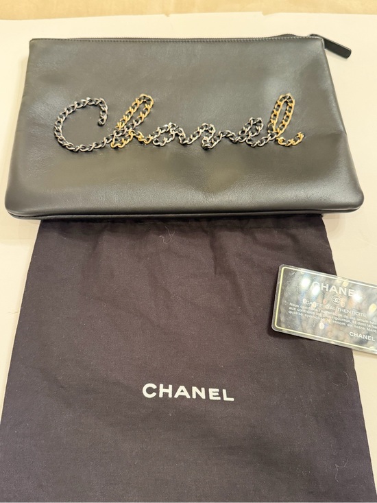 CHANEL Handbags - CHANEL Black Leather Clutch with Two-Tone Chain Script